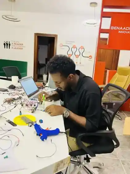 Hassan working on an electronics prototype at Benadir University Innovation Hub