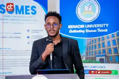 Hassan speaking during a Benadir University and SOMES event